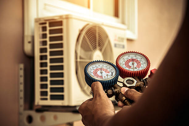 Professional Air Conditioning Service technician working in South Wales, NY